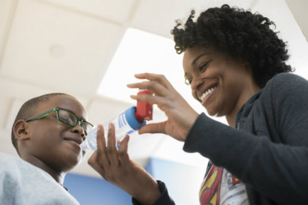 provider explains medication dose to pediatric patient