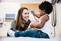 Toddler playing with a stethoscope